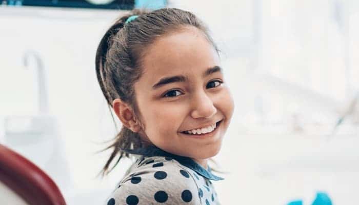 child patient wearing invisalign