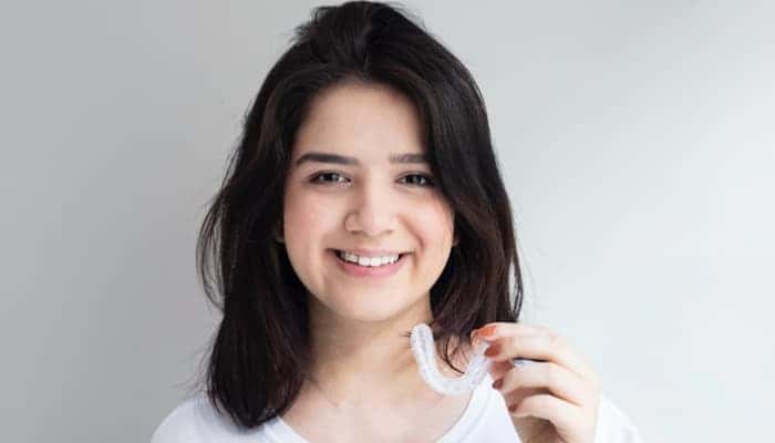 teen patient wearing invisalign