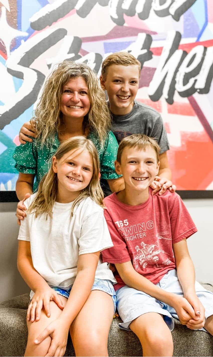 parent and children smiling at visit